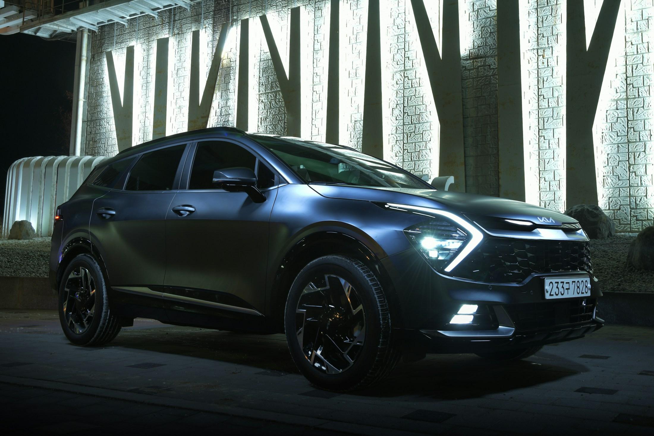 Kia Sportage SUV parked outside a modern building